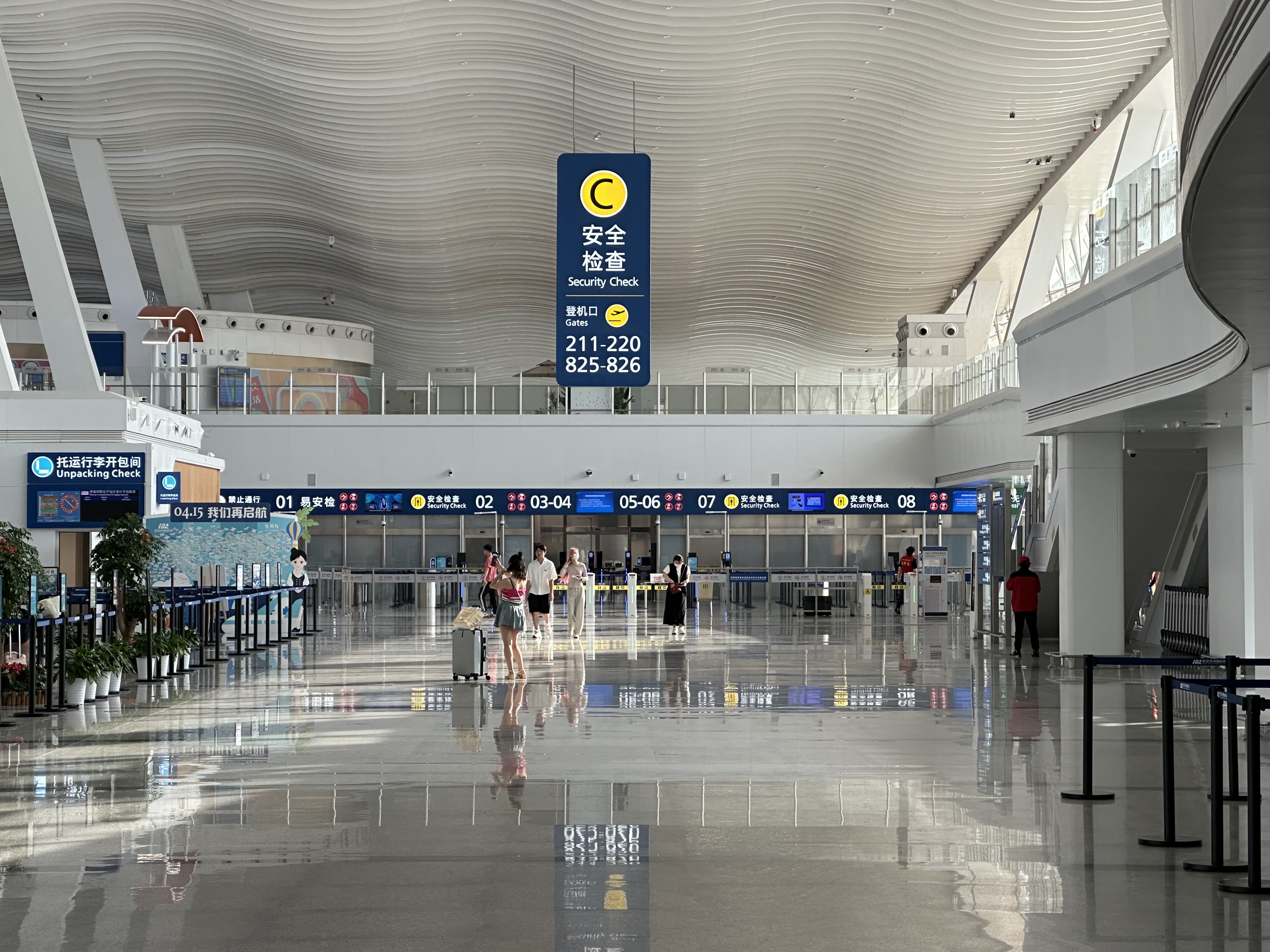 Passengers queuing at security checkpoint C in Wuhan Tianhe Airport Terminal 2.